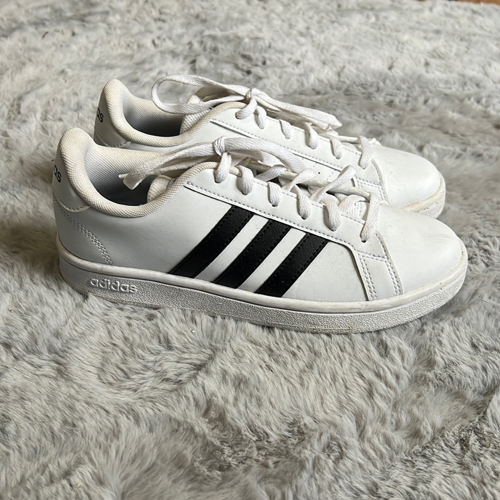 Size 6.5 white adidas shoes.